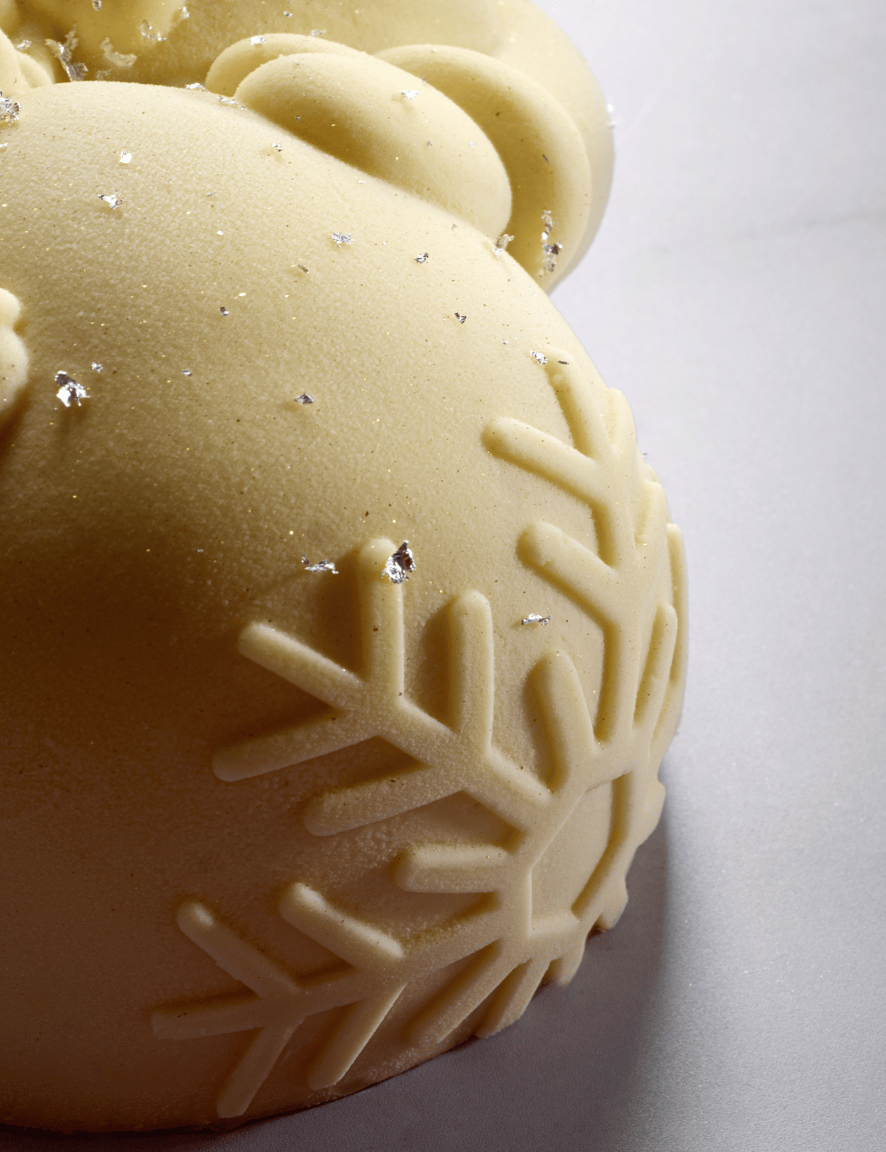 Close-up of the large snowflake engraved as a signature on the Frosty Yule log